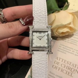 HERMES🌸🌸🌸 Heure H Collection, 2019 Hong Kong DFS Global Duty Free. Vibrant-colored straps encircle the distinctive "H"-shaped case, while the mother-of-pearl dial features 11 diamond accents. The 26mm medium size—HERMES fans know the deal 😍